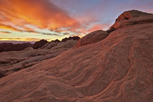 Nevada Prints: Brilliant orange clouds at sunrise over sandstone, Valley Of Fire State Park, Nevada