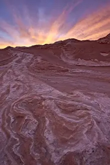 White Pocket Prints: Brilliant orange clouds at sunset over red and white sandstone