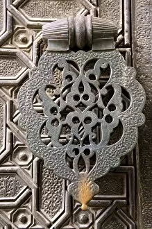 Images Dated 14th April 2010: Bronze knocker on wooden engraved doors, Reales Alcazares, Seville, Andalucia