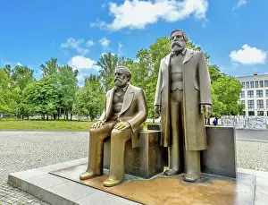 Socialism Prints: The bronze sculpture by Ludwig Engelhardt of Marx on left and Engels in Marx-Engels Forum in central Berlin
