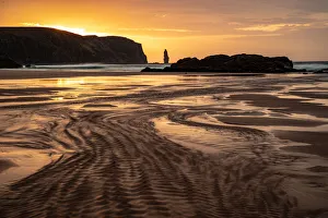 Am Buachaille sea stack at sunset, Sandwood Bay, Sutherland, Scotland, United Kingdom