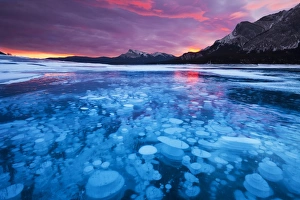 Alberta Prints: Bubbles and Cracks in the Ice with Kista Peak in the Background at Sunrise, Abraham Lake