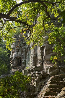 Traditionally Cambodian Prints: Buddha face on the Western Gate of Angkor Thom, Siem Reap, Cambodia, Southeast Asia