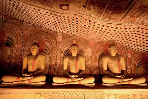 Meditation Prints: Buddha statues in Dambulla Cave Temple showcase ancient artistry in Sri Lanka
