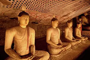 Meditation Prints: Buddha statues and murals display in Dambulla Cave Temple showcasing ancient Sri Lankan art and culture