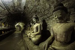 Tunnel Prints: Buddha statues in the underground corridors of Htukkanthein temple, Mrauk U, Rakhine