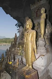 Buddhas in Pak Ou caves, Mekong River, near Luang Prabang, Laos, Indochina