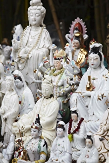 Shrines Prints: Buddhist figurines at shrine in bamboo forest, Quarry Bay, Hong Kong, China, Asia