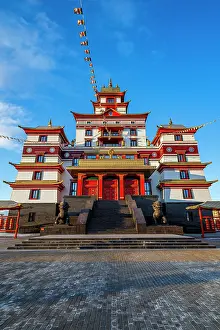 Worship Prints: Buddhist monastery Thubten Shedrub Ling with colorful flags and blue sky in Kyzyl Russia