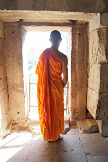 12th Century Gallery: A Buddhist monk exploring the Angkor Archaeological Complex, UNESCO World Heritage Site