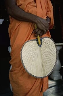 Buddhist monk with fan