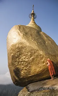 Mon State Prints: Buddhist Monk praying at Golden Rock (Kyaiktiyo Pagoda), Mon State, Myanmar (Burma), Asia