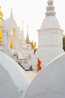Chedi Prints: Buddhist monk walking around Wat Suan Dok Temple in Chiang Mai