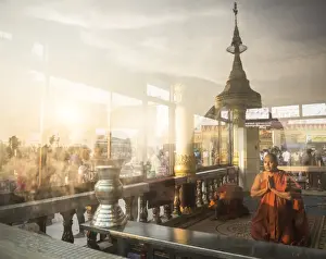 Mon State Prints: Buddhist Monks praying at Golden Rock Temple (Kyaiktiyo Pagoda) at sunset, Mon State