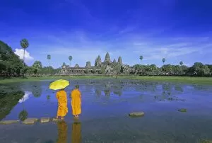 Buddhist monks standing in front of Angkor Wat, Angkor, UNESCO World Heritage Site