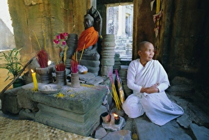 Focusing Prints: Buddhist nun meditating in the Bayon Temple, at Angkor, Siem Reap, Cambodia