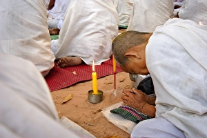 Ceremonies Prints: A Buddhist nun prays during a ceremony amongst the temples of Angkor, Cambodia