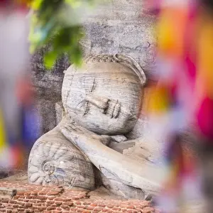 Gal Vihara Prints: Buddhist prayer flags and reclining Buddha in Nirvana at Gal Vihara Rock Temple