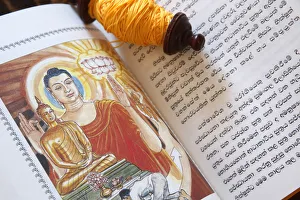 Close Up View Prints: Buddhist sacred texts and a roll of Sai-Sin (sacred thread), Life of Siddhartha Gautama