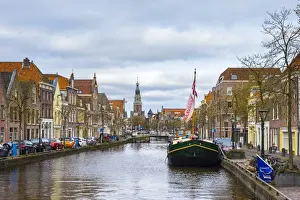 Alkmaar Prints: Buildings along the Luttik Oudorp canal and the tower of the Waaggebouw (The Waag) weigh house