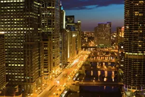 Buildings along Wacker Drive and the Chicago River at dusk, Chicago, Illinois