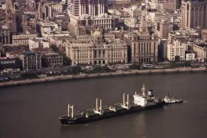 Images Dated 27th October 2005: Bund and cargo ship on the Huangpu River, Shanghai, China, Asia