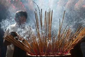 Images Dated 9th March 2010: Burning incense during Tet, the Vietnamese lunar New Year celebration, Quan Am Pagoda