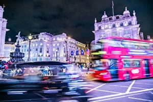 Night Life Collection: A bus and taxi zoom round Piccadilly Circus, London, England