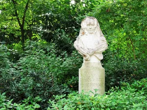 Popular Prints: Bust of Sophie Rostopchine in the Jardin du Luxembourg in Paris surrounded by greenery on a sunny day