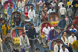 Images Dated 26th December 2007: Busy rickshaw traffic on a street crossing in Dhaka, Bangladesh, Asia