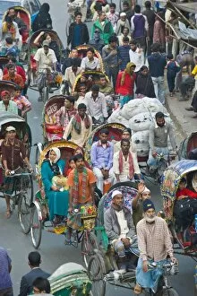 Images Dated 26th December 2007: Busy rickshaw traffic on a street crossing in Dhaka, Bangladesh, Asia