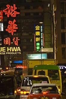 Bus y s treet in Kowloon at night, Hong Kong, China, As ia