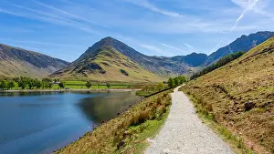 Buttermere with Fleetwith Pike behind, seen from the popular footpath around the lake. The Lake District, Cumbria, England, UK