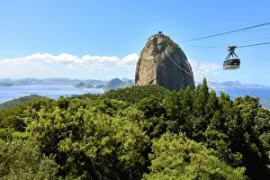 Typically Brazilian Prints: Cable car heading to Sugarloaf mountain seen from Morro da Urca