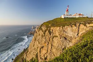 Sintra Prints: The Cabo da Roca lighthouse overlooks the promontory towards the Atlantic Ocean at sunset