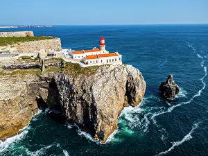 Safety Prints: Cabo de Sao Vicente lighthouse sits on cliffs overlooking the Atlantic Ocean in Sagres