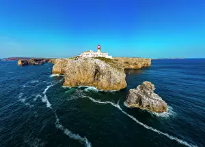 Bright Prints: Cabo de Sao Vicente lighthouse stands tall on cliffs surrounded by ocean views in Sagres