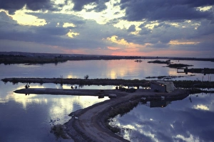Romantic Skies Prints: Cafe on a jetty at Raqqa at sunset