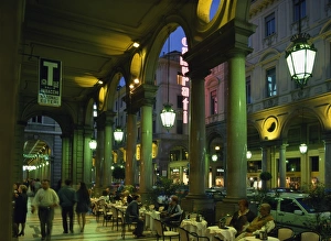 Cafes in the arcade on the Via Roma at night
