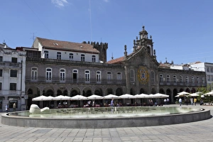 Cafes stand in front of La Arcade and Igreja da Lapa church on the Praca da Republica Cafes stand in front of La Arcade and Igreja da Lapa church on the Praca da Republica