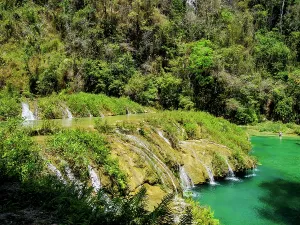 Cascading Prints: Cahabon River waterfall flows through natural landscape in Guatemala near Semuc Champey