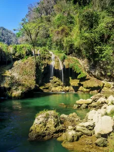 Alta Prints: Cahabon River waterfall flows through rocks and greenery in Semuc Champey Natural Monument in Guatemala