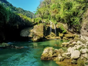 Alta Prints: Cahabon River waterfalls flow into blue waters at Semuc Champey Natural Monument in Lanquin