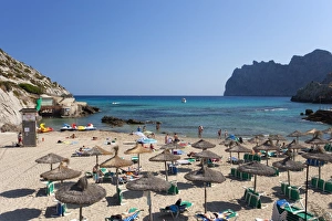 Umbrellas Prints: Cala de Sant Vicenc beach and bay in summer, Majorca, Balearic Islands