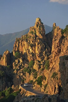 Mountain Road Prints: The Calanche, white granite rocks, with car on road below, near Piana, Corsica