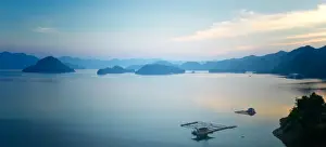 Hangzhou Prints: A calm view of southeast Qiandao Lake in Zhejiang province at dusk, Zhejiang, China, Asia