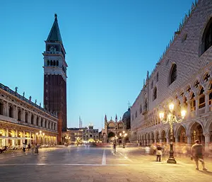Piazza Prints: Campanile stands tall in St. Marks Square while visitors explore Venice streets at dusk