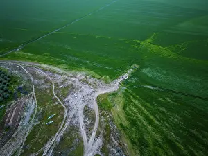 Dirt Prints: Camper van in green landscape of Marmara dry lake during sunset in Turkey with fields