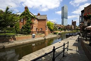Canal and lock keepers cottage at Castlefield with the Beetham Tower in the background
