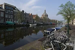 Canal view looking towards Mare Church, Leiden, Netherlands, Europe